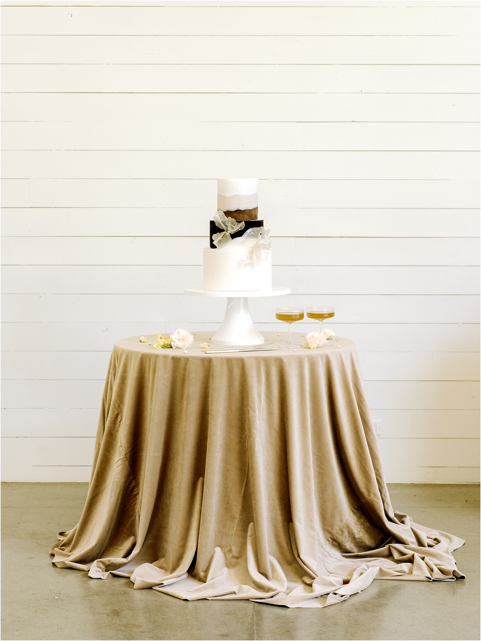 three-tier-cream-and brown-wedding-cake