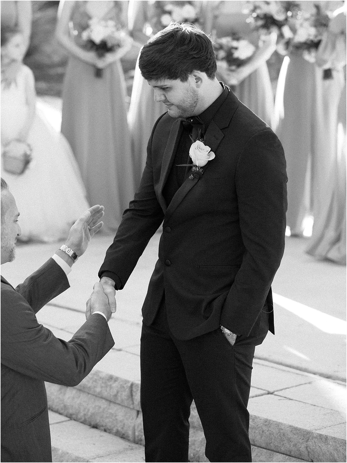 groom-shaking-brides-fathers-hand