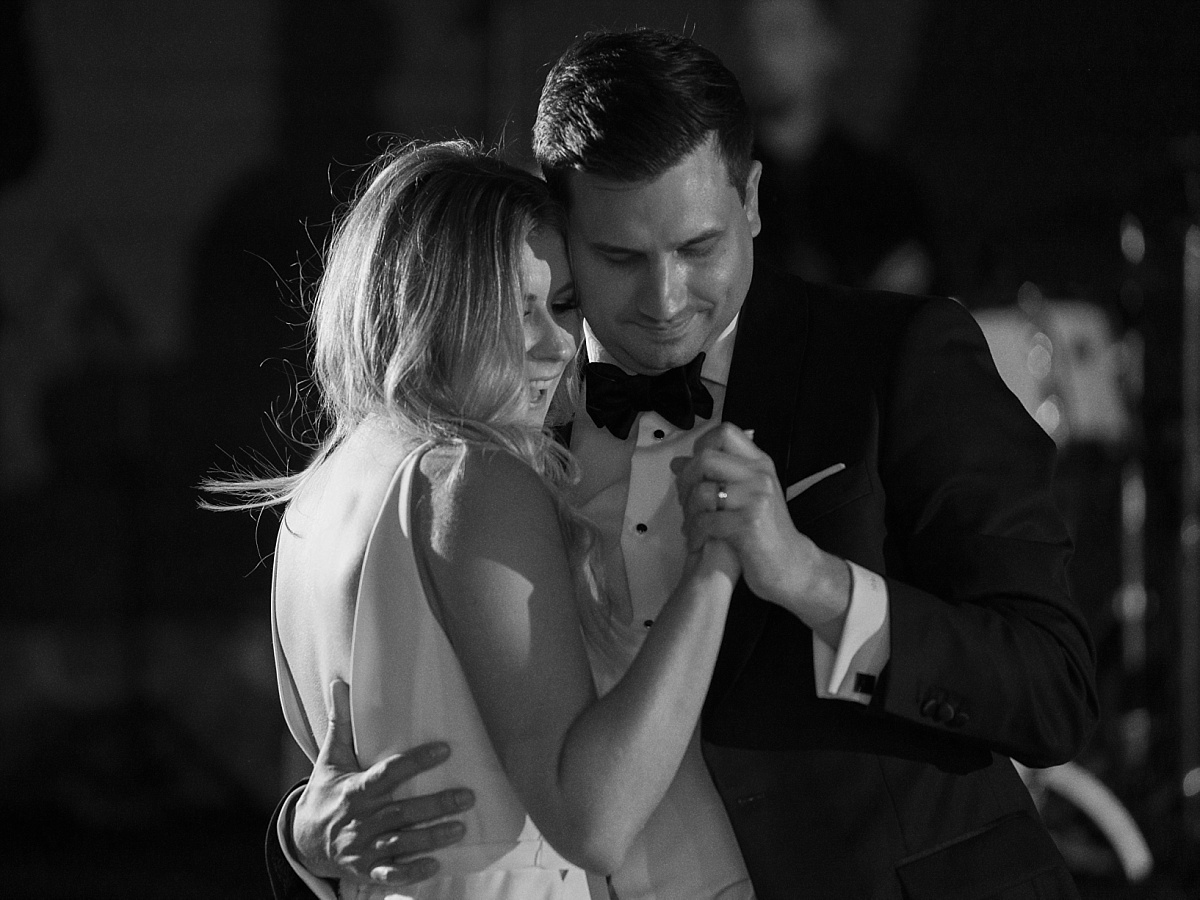 Bride and groom dancing their first dance during the wedding reception at Hyatt Lost Pines.