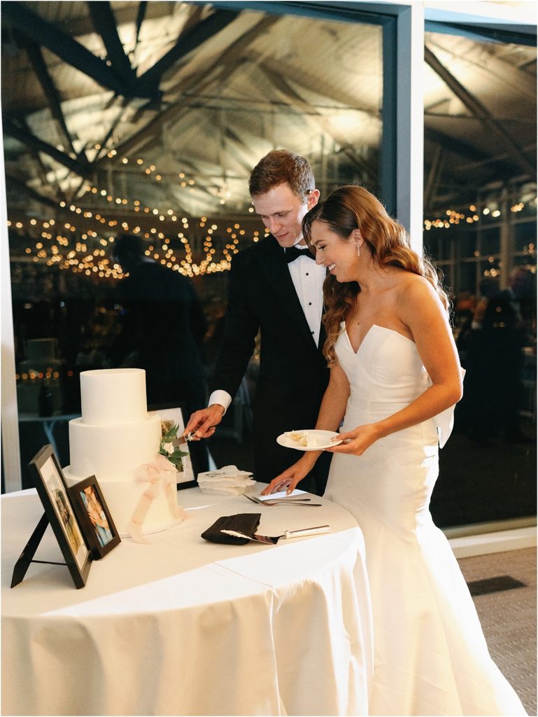 bride and groom cutting cake at Lakeway Resort and Spa wedding reception.