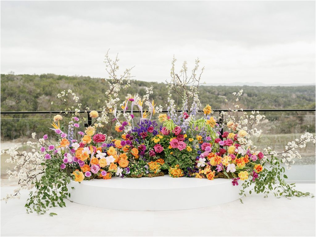 Colorful floral installation on the terrace of the ceremony site.