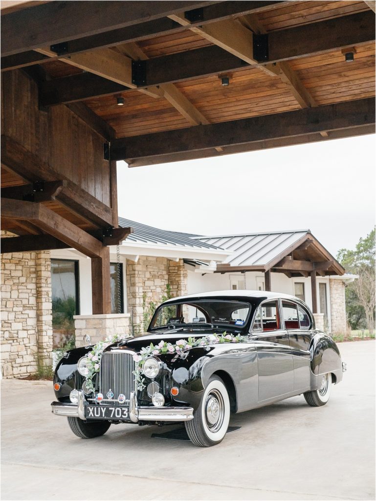 Vintage black Jaguar getaway car for the bride and groom.