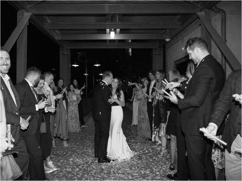 Bride and Groom wedding grand exit outside Hotel Emma with confetti.