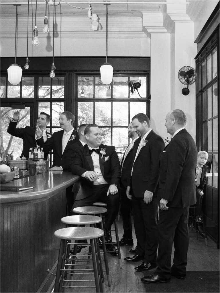 Groom with groomsmen in the bar at Hotel Emma.