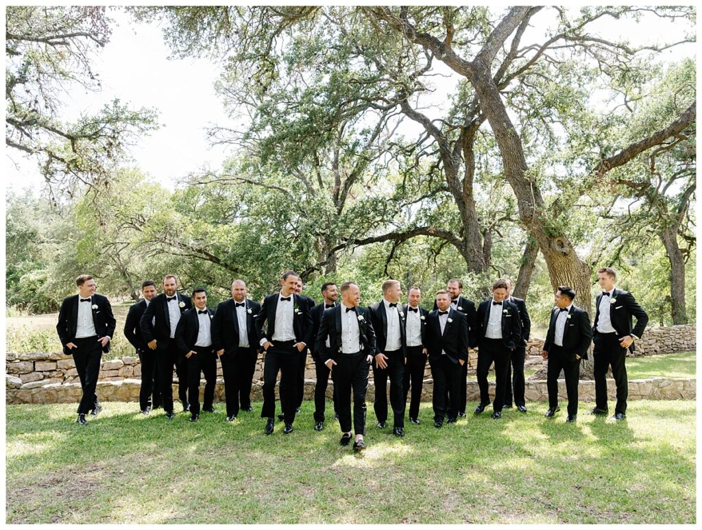 Groom outside with his groomsmen at the Addison Grove.