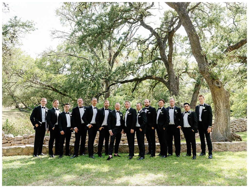 Groom outside with his groomsmen at the Addison Grove.