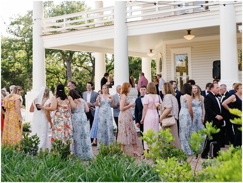 Guests mingling during cocktail hour at The Grand Lady wedding venue.