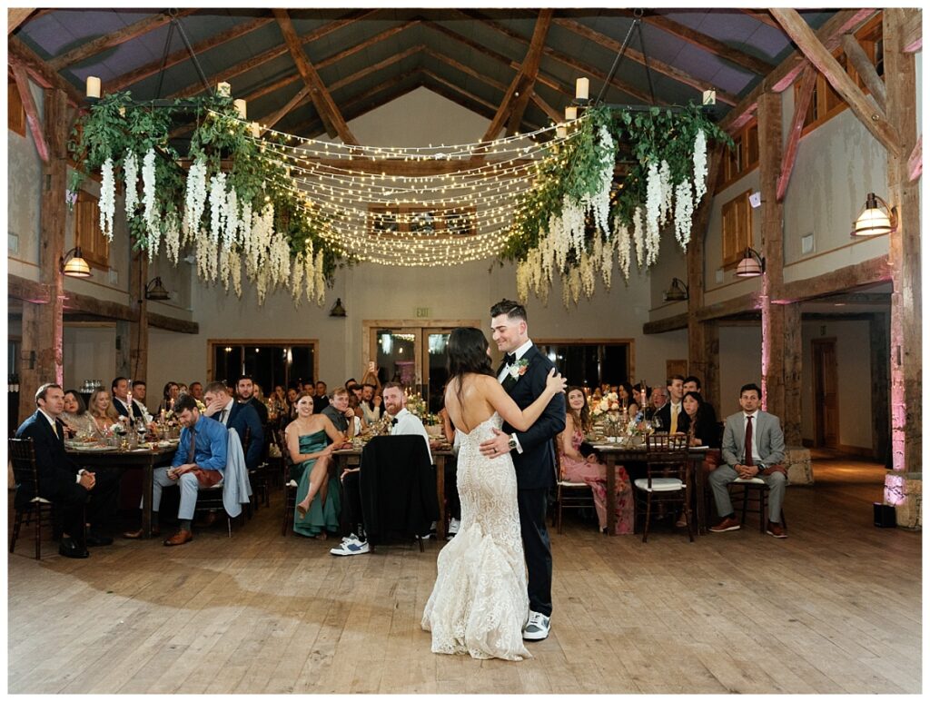 Savana and Casey share their first dance as husband and wife in the beautifully decorated reception space, surrounded by friends and family.